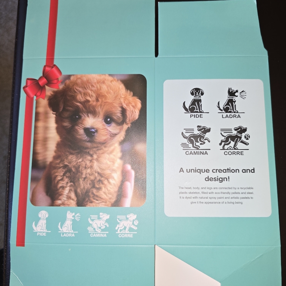 Interactive Puppy Toy with Red Bow.  Looks Like A Goldendoodle